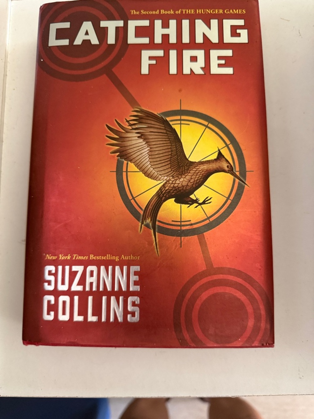 Catching Fire by Suzanne Collins - Red & Gold Hardcover